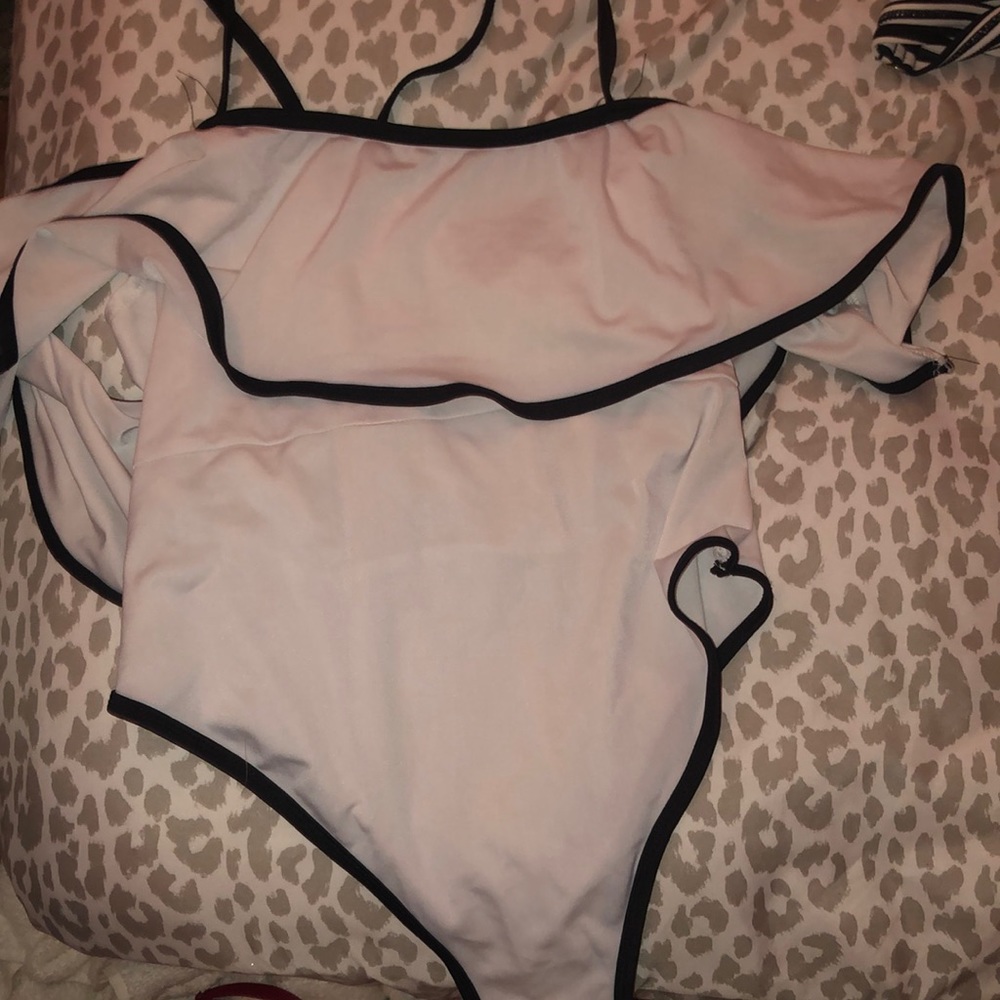 White and black ruffle one peice bikini.